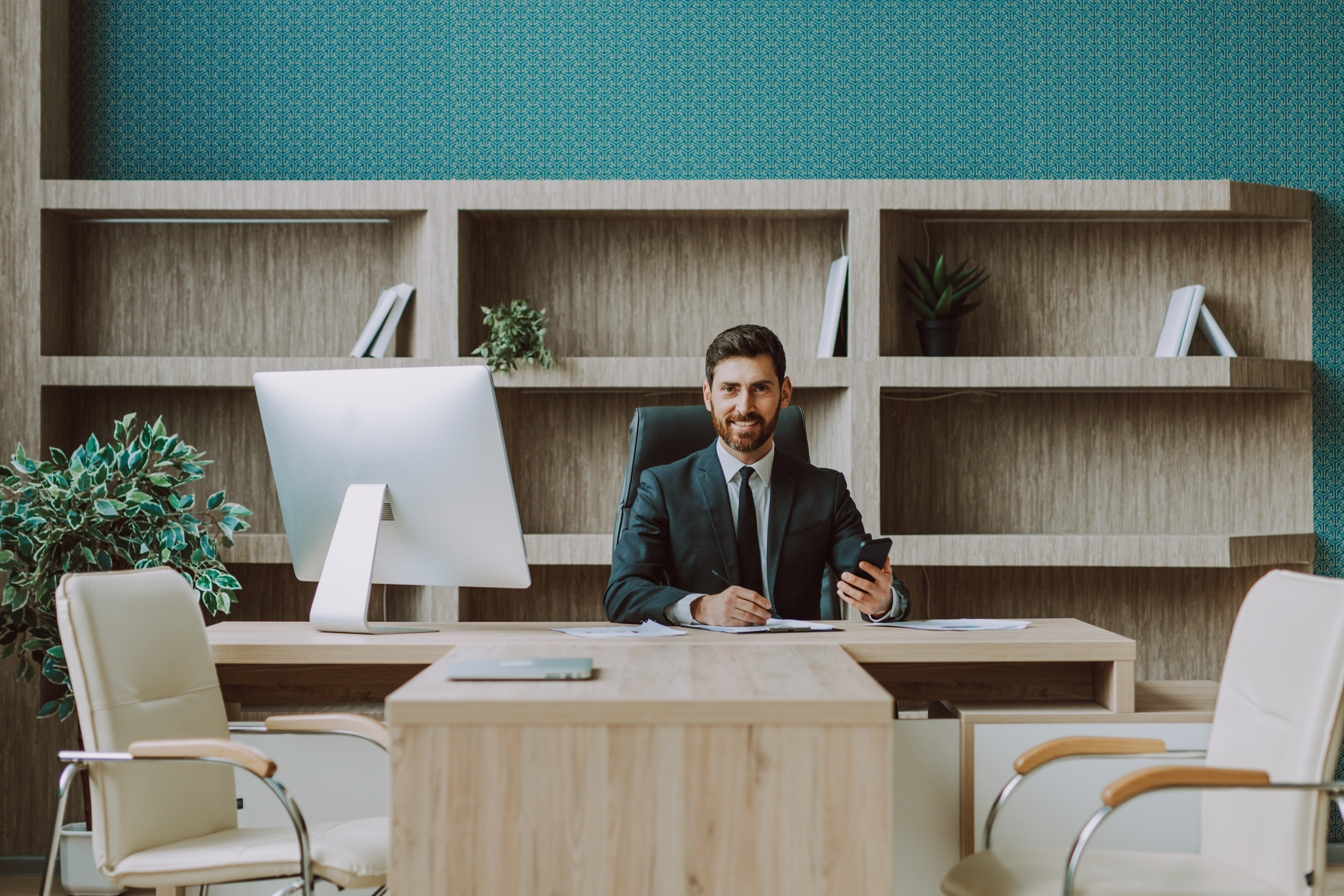 Business founder preparing at his office desk before a conference