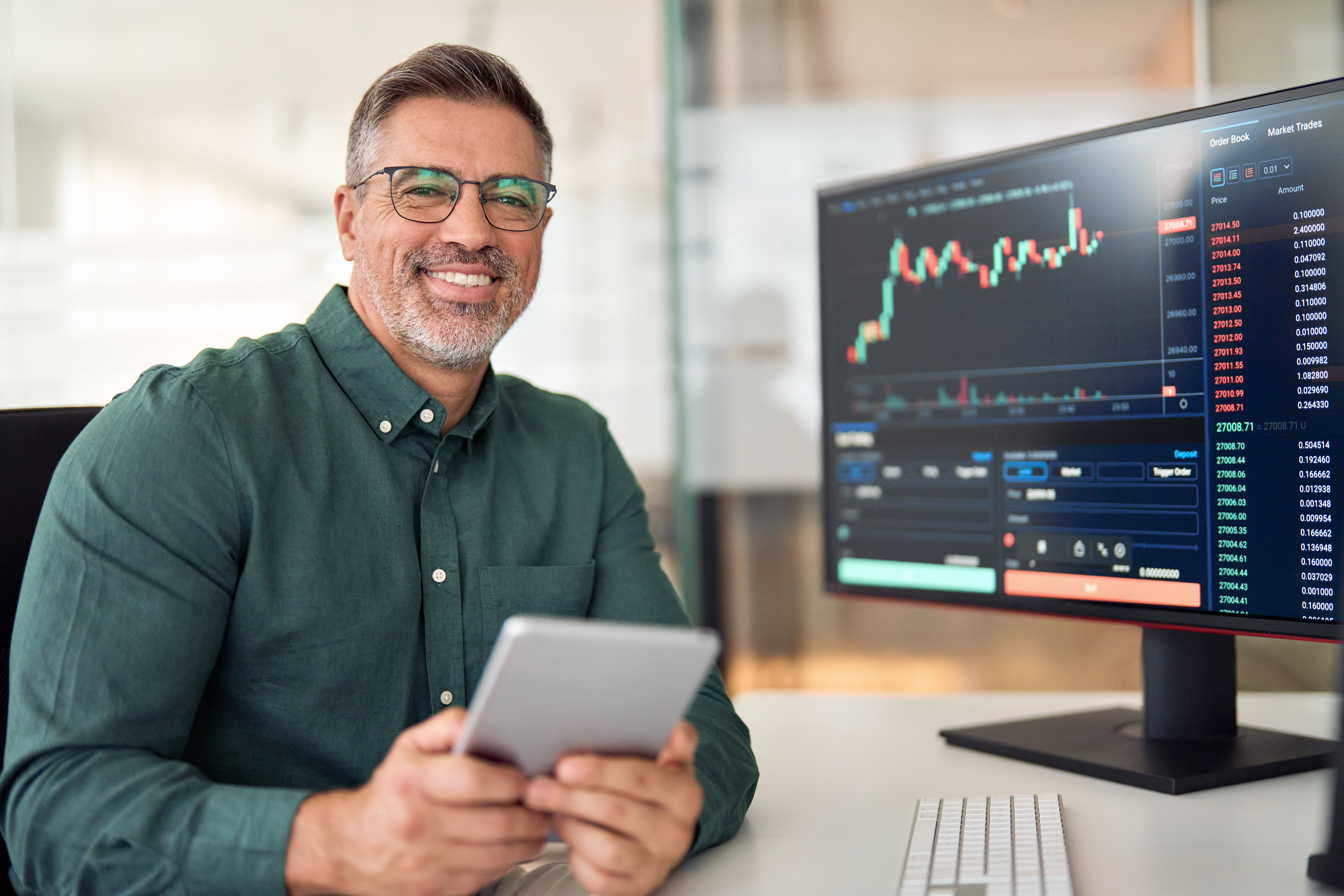 Mature man analyzing stock data